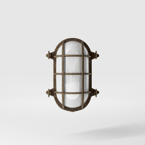 Nautical outdoor wall lamp in brass with protective grid and glass, maritime style for outdoor lighting by Ghidini 1849 - Finish: OAS Antique Brass