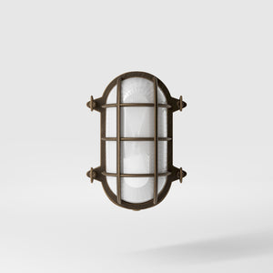 Nautical outdoor wall lamp in brass with protective grid and glass, maritime style for outdoor lighting by Ghidini 1849 - Finish: OBM Bronze Satin Matt Brass