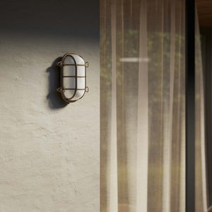 Nautical outdoor wall lamp in brass with protective grid and glass, maritime style for outdoor lighting by Ghidini 1849 - Finish: OBM Bronze Satin Matt Brass