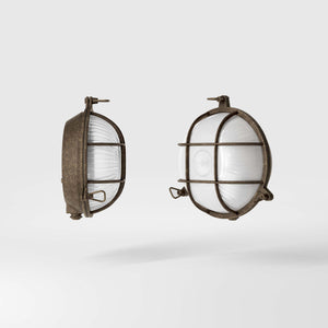 Round outdoor wall lamp in brass with protective grid and glass, marine style for outdoor lighting by Ghidini 1849 - Finish: OAS Antique Brass