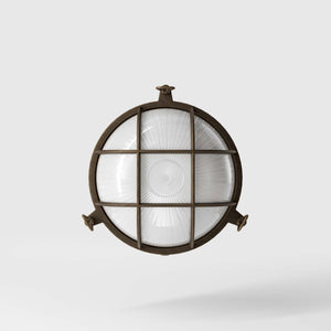 Round outdoor wall lamp in brass with protective grid and glass, marine style for outdoor lighting by Ghidini 1849 - Finish: OBM Bronze Satin Matt Brass