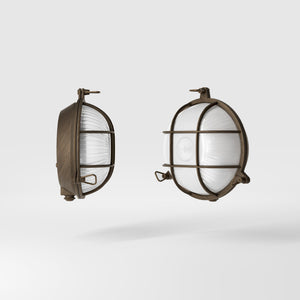 Round outdoor wall lamp in brass with protective grid and glass, marine style for outdoor lighting by Ghidini 1849 - Finish: OBM Bronze Satin Matt Brass