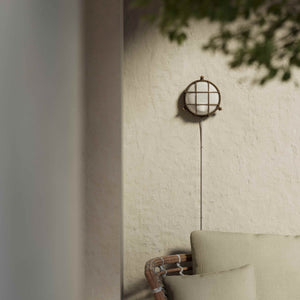 Round outdoor wall lamp in brass with protective grid and glass, marine style for outdoor lighting by Ghidini 1849 - Finish: OBM Bronze Satin Matt Brass