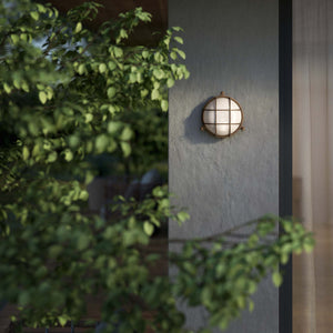 Round outdoor wall lamp in brass with protective grid and glass, marine style for outdoor lighting by Ghidini 1849 - Finish: OBM Bronze Satin Matt Brass