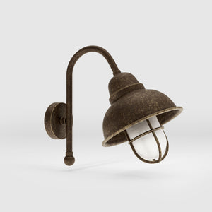 Outdoor industrial wall lamp Chronos with brass structure, bell-shaped diffuser and protective transparent glass cage for exterior lighting by Ghidini 1849 - Finish: OAS Antique Brass