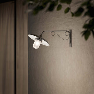 Brass outdoor wall lamp with decorative arm and protected glass by Ghidini 1849 - Finish: OBR Dark Bronze