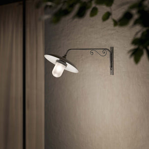 Brass outdoor wall lamp with decorative arm and protected glass by Ghidini 1849 - Finish: OBR Dark Bronze