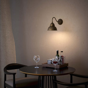 Brass wall lamp industrial vintage style curved arm bell shade round base retro design handcrafted Italian details by Ghidini 1849 - Finish: OAS Antique Brass