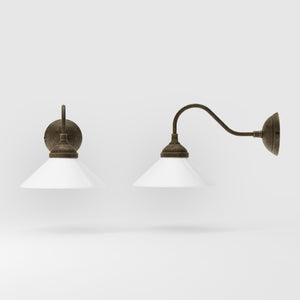 Vintage style wall lamp in brass with curved arm and white glass shade, Sofia collection of Italian craftsmanship by Ghidini 1849 - Finish: OAS Antique Brass