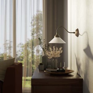 Vintage style wall lamp in brass with curved arm and white glass shade, Sofia collection of Italian craftsmanship by Ghidini 1849 - Finish: OAS Antique Brass