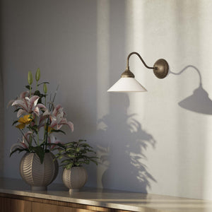 Vintage style wall lamp in brass with curved arm and white glass shade, Sofia collection of Italian craftsmanship by Ghidini 1849 - Finish: OAS Antique Brass