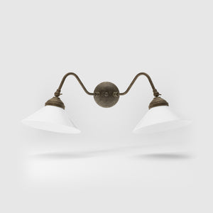 Vintage style wall lamp in brass with curved arm and white glass shade, Sofia collection of Italian craftsmanship by Ghidini 1849 - Finish: OAS Antique Brass