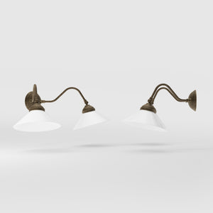 Vintage style wall lamp in brass with curved arm and white glass shade, Sofia collection of Italian craftsmanship by Ghidini 1849 - Finish: OAS Antique Brass