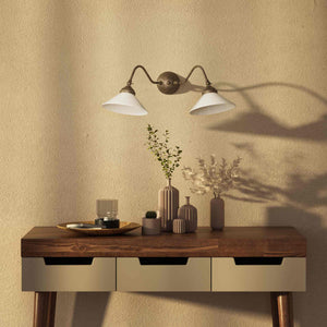 Vintage style wall lamp in brass with curved arm and white glass shade, Sofia collection of Italian craftsmanship by Ghidini 1849 - Finish: OAS Antique Brass