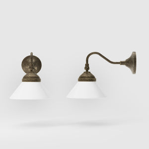 Industrial brass wall lamp with adjustable arm and white glass shade, Italian design Sofia for versatile lighting by Ghidini 1849 - Finish: OAS Antique Brass