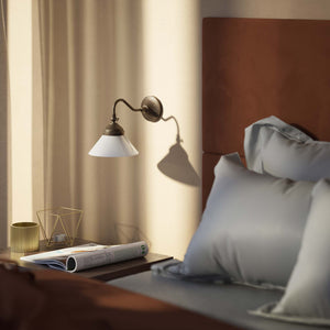 Industrial brass wall lamp with adjustable arm and white glass shade, Italian design Sofia for versatile lighting by Ghidini 1849 - Finish: OAS Antique Brass