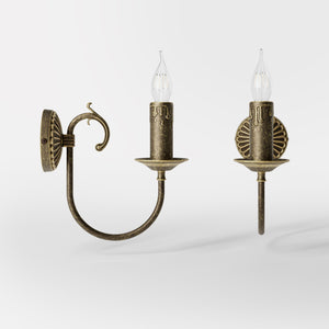 Classic wall lamp in brass with curved arm and candle-effect bulb holder, elegant vintage design by Ghidini 1849 - Finish: OAS Antique Brass