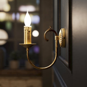 Classic wall lamp in brass with curved arm and candle-effect bulb holder, elegant vintage design by Ghidini 1849 - Finish: OBS Bronze Satin Brass