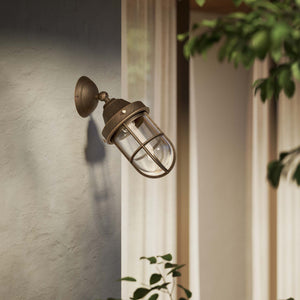 Rustic outdoor wall light in brass with clear glass shade, industrial maritime design, and adjustable joint by Ghidini 1849 - Finish: OBM Bronze Satin Matt Brass