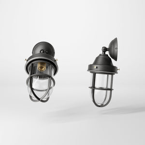 Rustic outdoor wall light in brass with clear glass shade, industrial maritime design, and adjustable joint by Ghidini 1849 - Finish: OBR Dark Bronze