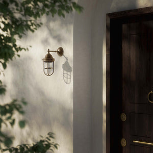 Outdoor wall lamp in brass with a transparent glass cage, industrial style, weather-resistant by Ghidini 1849 - Finish: OAS Antique Brass