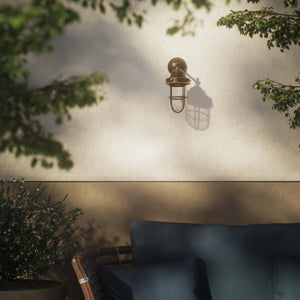 Outdoor wall lamp in brass with a transparent glass cage, industrial style, weather-resistant by Ghidini 1849 - Finish: OAS Antique Brass