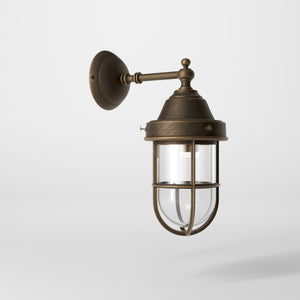 Outdoor wall lamp in brass with a transparent glass cage, industrial style, weather-resistant by Ghidini 1849 - Finish: OBM Bronze Satin Matt Brass