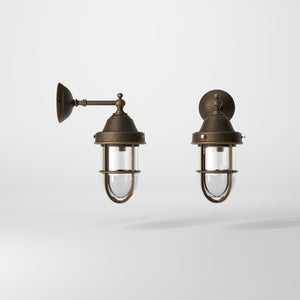 Outdoor wall lamp in brass with a transparent glass cage, industrial style, weather-resistant by Ghidini 1849 - Finish: OBM Bronze Satin Matt Brass