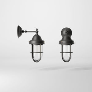 Outdoor wall lamp in brass with a transparent glass cage, industrial style, weather-resistant by Ghidini 1849 - Finish: OBR Dark Bronze