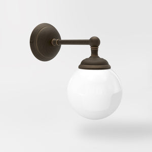 Brass wall lamp with white glass globe, vintage contemporary design for interiors by Ghidini 1849 - Finish: OBM Bronze Satin Matt Brass