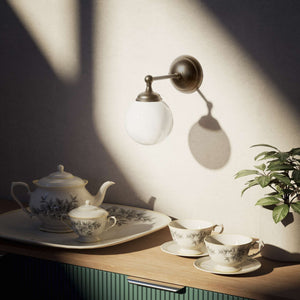 Brass wall lamp with white glass globe, vintage contemporary design for interiors by Ghidini 1849 - Finish: OBM Bronze Satin Matt Brass