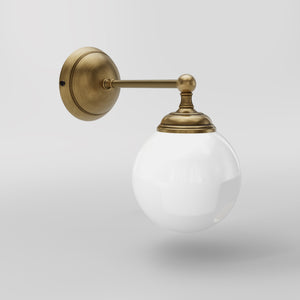 Brass wall lamp with white glass globe, vintage contemporary design for interiors by Ghidini 1849 - Finish: OBS Bronze Satin Brass