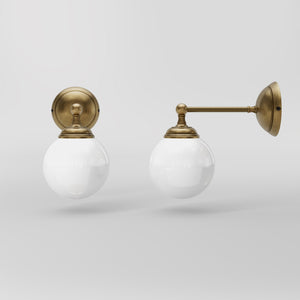 Brass wall lamp with white glass globe, vintage contemporary design for interiors by Ghidini 1849 - Finish: OBS Bronze Satin Brass