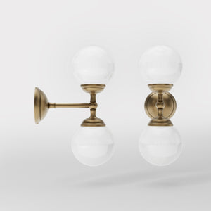 Art Deco wall sconce with two opal glass spheres and brass structure, classic and elegant Italian design for interior lighting - Finish: OBS Bronze Satin Brass