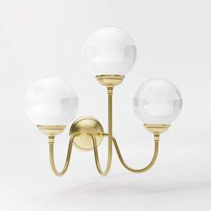 Brass wall lamp with three glossy white glass globes, elegant design, interior lighting by Ghidini 1849 - Finish: OBV Bronze Satin Light Brass