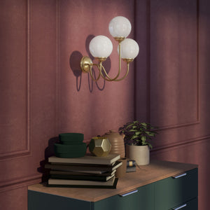 Brass wall lamp with three glossy white glass globes, elegant design, interior lighting by Ghidini 1849 - Finish: OBV Bronze Satin Light Brass