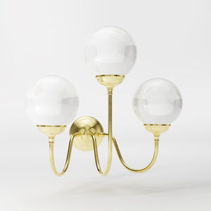 Brass wall lamp with three glossy white glass globes, elegant design, interior lighting by Ghidini 1849 - Finish: OLV Polished Brass