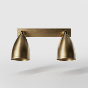 Brass wall lamp with two adjustable spots, perfect for living rooms, offices, and industrial-style interiors by Ghidini 1849 - Finish: OBS Bronze Satin Brass