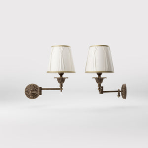 Classic brass wall lamp with adjustable arm and ivory fabric shade, gold decorative trim, floral rosette base London - Finish: OAS Antique Brass