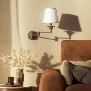 Classic brass wall lamp with adjustable arm and ivory fabric shade, gold decorative trim, floral rosette base London - Finish: OAS Antique Brass