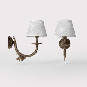 Classical brass wall lamp with decorated white fabric shade, curved arm and ornamental rosette, traditional floral details - Finish: OAS Antique Brass