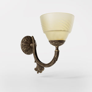 Art Nouveau brass wall lamp with floral decorated arm and frosted glass diffuser with geometric diamond pattern by Ghidini 1849 - Finish: OAS Antique Brass
