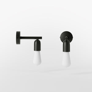 Minimalist brass wall lamp for interiors, contemporary and essential style, perfect for homes, offices, and commercial spaces by Ghidini 1849 - Finish: ONO Matt Black