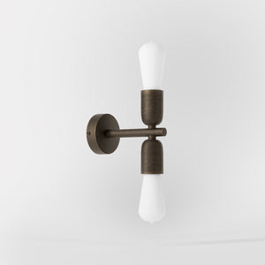 Modern brass wall sconce with dual light, minimalist and refined design, ideal for homes, hotels, and boutiques by Ghidini 1849 - Finish: OBM Bronze Satin Matt Brass