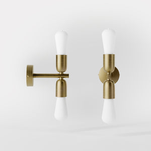 Modern brass wall sconce with dual light, minimalist and refined design, ideal for homes, hotels, and boutiques by Ghidini 1849 - Finish: OBV Bronze Satin Light Brass