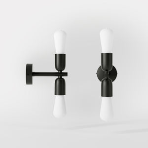 Modern brass wall sconce with dual light, minimalist and refined design, ideal for homes, hotels, and boutiques by Ghidini 1849 - Finish: ONO Matt Black