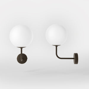 Art Deco wall sconce with frosted glass sphere and curved brass arm, Made in Italy design by Ghidini 1849 - Finish: OBM Bronze Satin Matt Brass