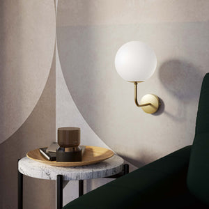 Art Deco wall sconce with frosted glass sphere and curved brass arm, Made in Italy design by Ghidini 1849 - Finish: OBV Bronze Satin Light Brass