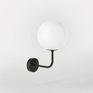 Art Deco wall sconce with frosted glass sphere and curved brass arm, Made in Italy design by Ghidini 1849 - Finish: ONO Matt Black