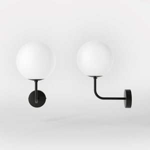 Art Deco wall sconce with frosted glass sphere and curved brass arm, Made in Italy design by Ghidini 1849 - Finish: ONO Matt Black